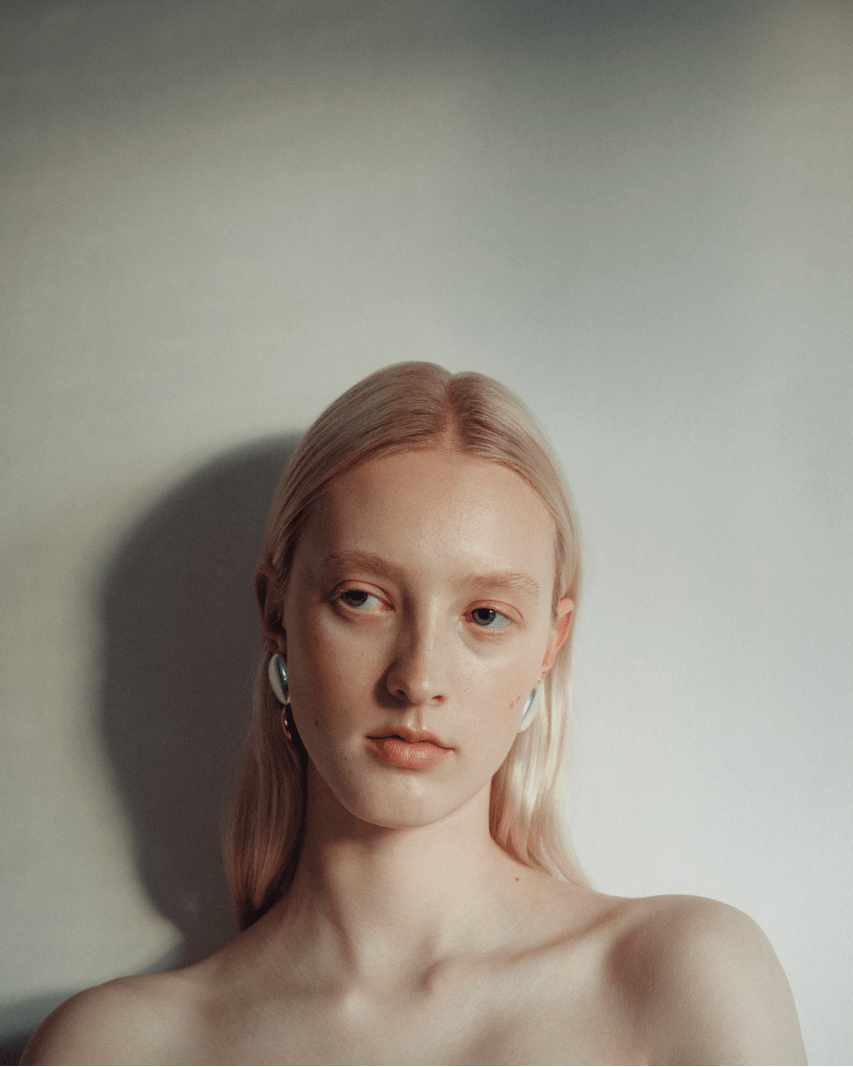 Module earrings, shown worn.