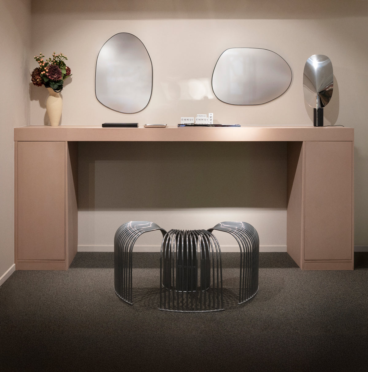 The ENNUI Atelier studio at NK Stockholm, with its sculptural black slatted seat.