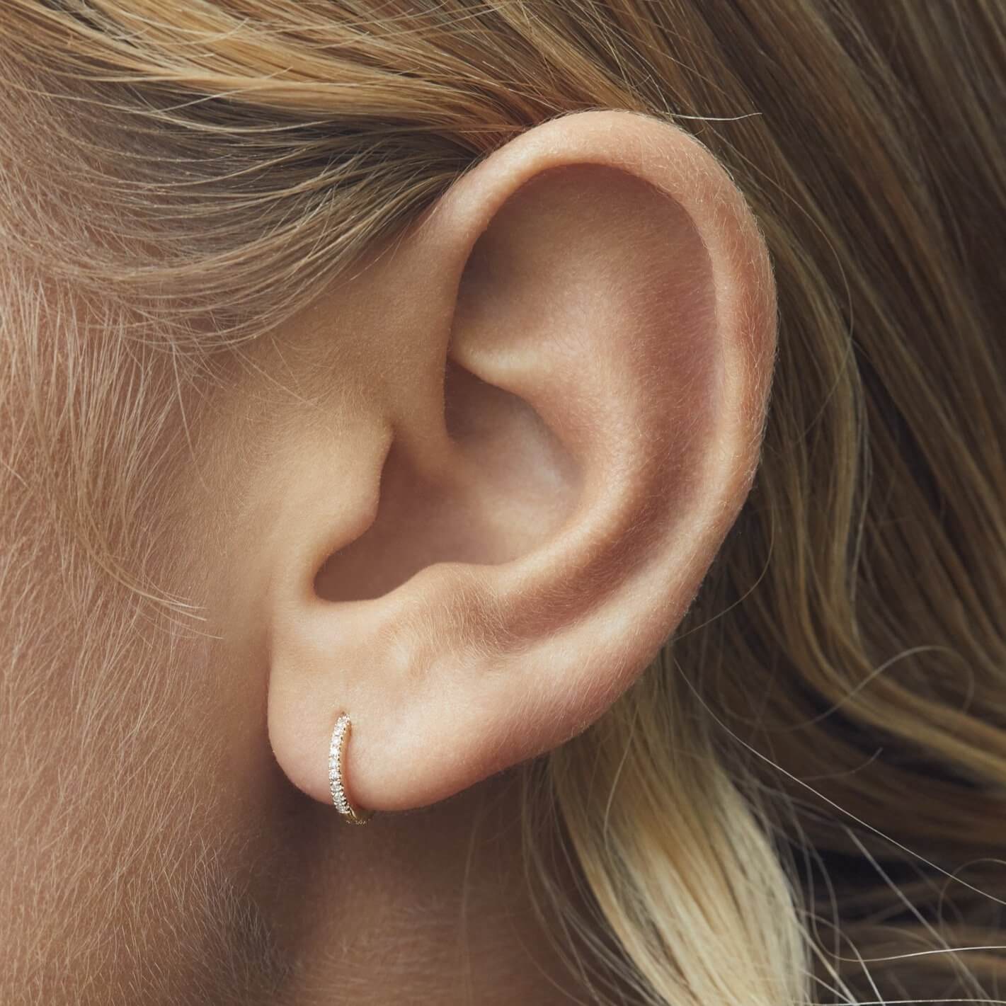 9mm huggie white diamonds yellow gold on girl