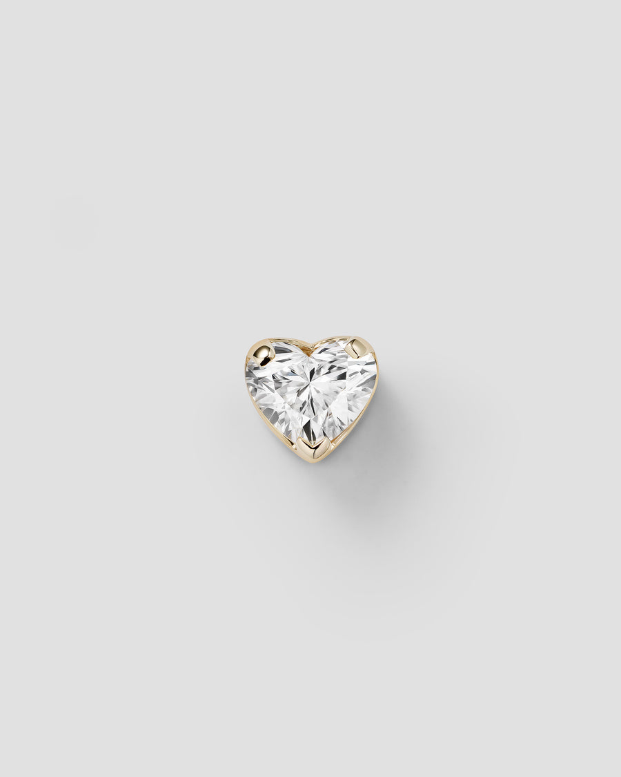 Erosia heart in 14k yellow gold, set with a white diamond.