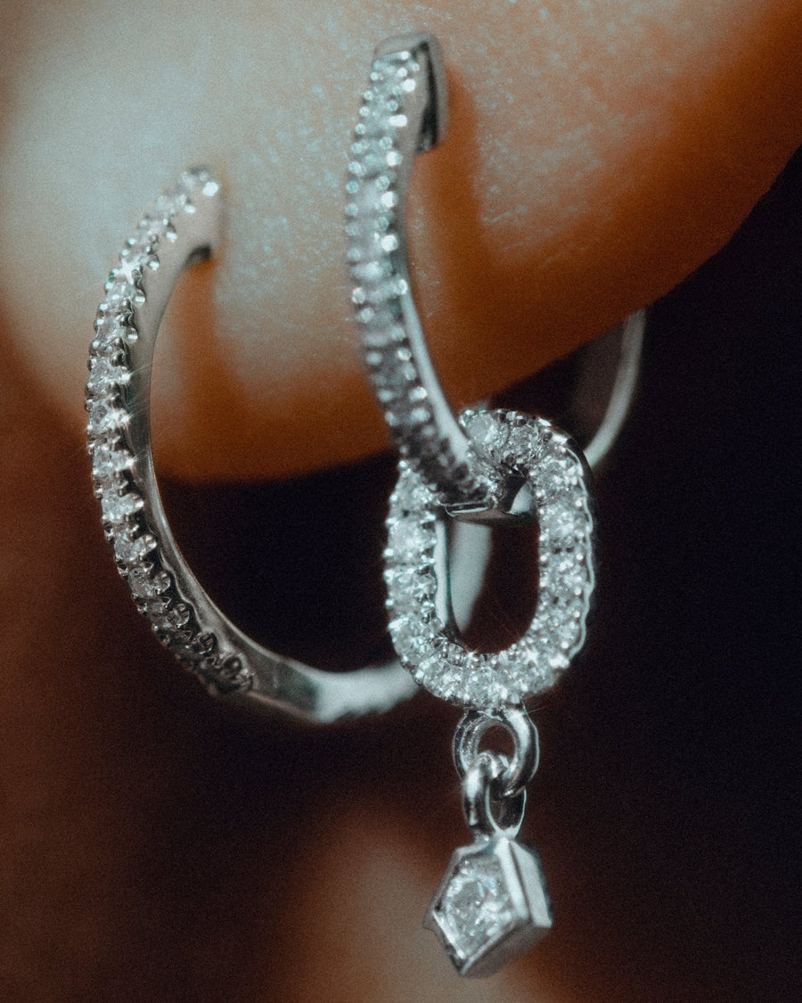 Echo pendant in 14k white gold, set with a natural diamond, detail view.
