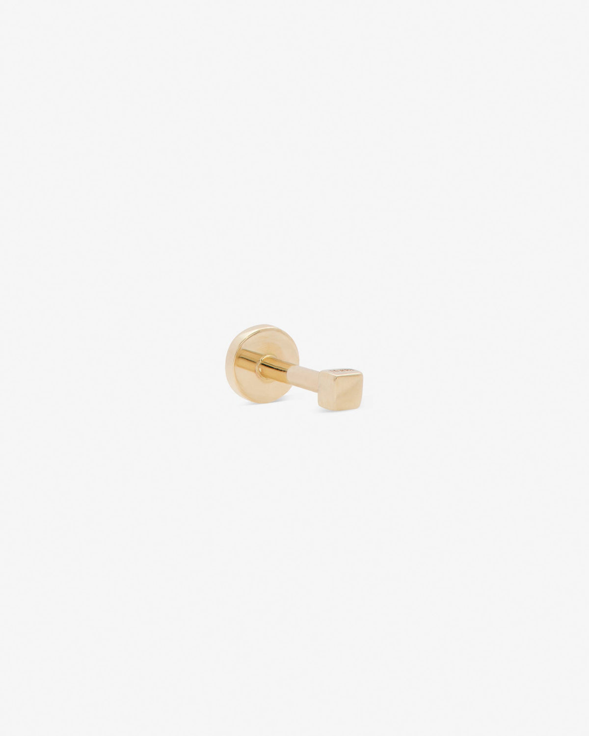Hip to be square labret in 14k yellow gold, detail view.